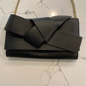 Ted Baker Crossboddy purse. Cute bow in front. Black with gold chain.